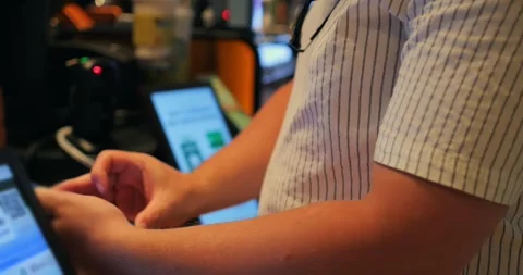 Mobile payment by person using smartphone at retail checkout terminal with Video stock 344728085
