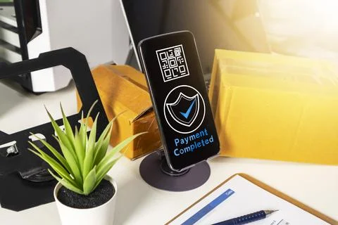 Mobile payment security concept on smartphone screen with delivery boxes on.. Stock Photos