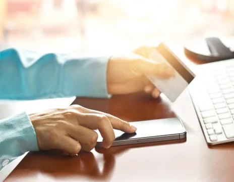 Mobile payments, hands using smartphone and credit card for online shopping 스톡 사진