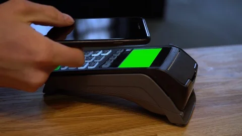 Mobile payments. Payment for purchases with a mobile phone with NFC technology Stock Footage 107226628