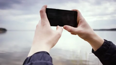 Mobile phone on the background of the sea. Stock Footage 89130918