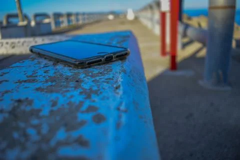 Mobile phone on the bench Stock Photos