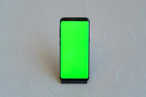 Mobile phone with blank screen on table Stock Photos