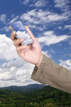 Mobile phone on cloud. Stock Photos