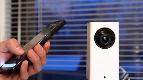 Mobile Phone Connected To a Home Security Camera CCTV 스톡 동영상 122113008