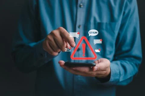 Mobile phone cybersecurity with spam message icon and warning notification .. Stock Photos
