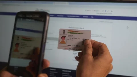 Mobile phone digital scanning Aadhaar card at home for e-KYC to verify customer Stock Footage 310178970