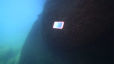 MOBILE PHONE FALLS DOWN UNDERWATER AND HITS THE FLOOR Stock Footage 146809324