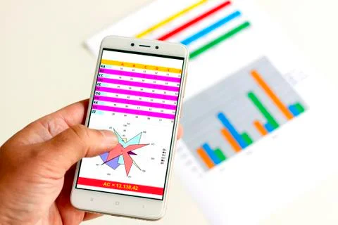 Mobile phone with graph Stock Photos