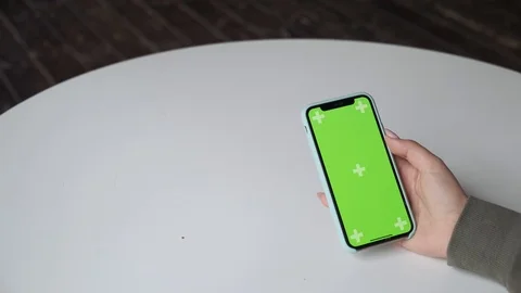 Mobile phone with green screen close up.  Chroma key on   the cell phone. Video stock 124114758