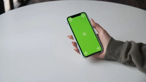 Mobile phone with green screen close up.  Chroma key on   the cell phone. Stock Footage 125120232