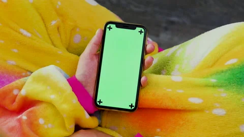 Mobile phone with a green screen in the hands of a girl. chroma Stock Footage 174306763