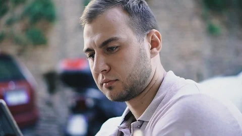 Mobile phone. The guy is looking at the cell phone. Stock Footage 122886184