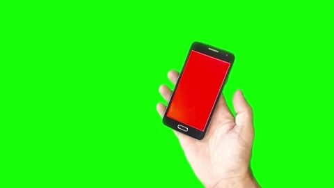 Mobile phone in hand on green background with glare Stock Footage 280362834