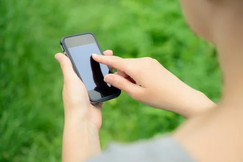 Mobile phone in hands Stock Photos