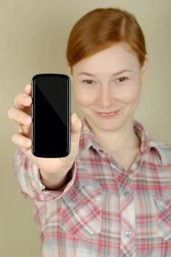 Mobile phone in his hand Stock Photos