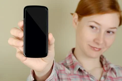 Mobile phone in his hand Stock Photos