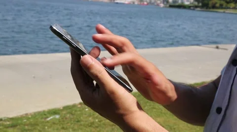 Mobile phone internet on beach Stock Footage 67425440