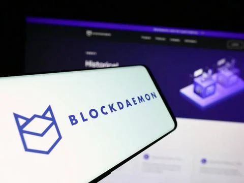  Mobile phone with logo of blockchain software company Blockdaemon Inc. in... Stock-Fotos