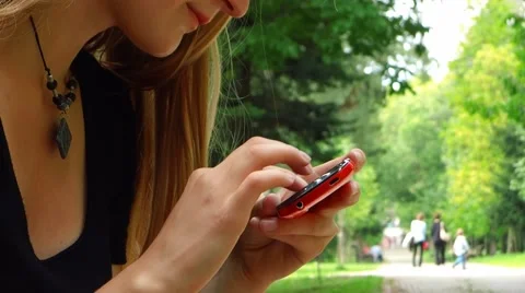 Mobile phone in park Stock Footage 41643666