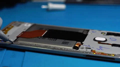 Mobile Phone Repair, Adding Glue Before Assembling Smartphone, Close Up Stock Footage 243814955