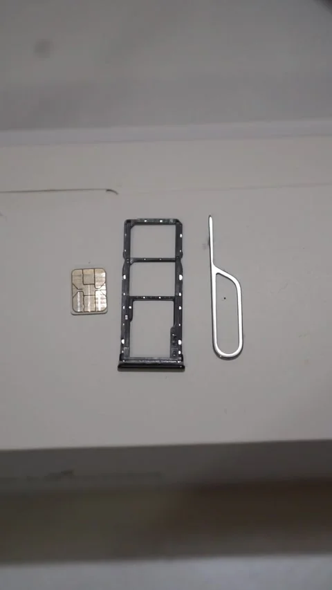 Mobile phone SIM card setup with tray and ejector tool Stock-Footage 324563333