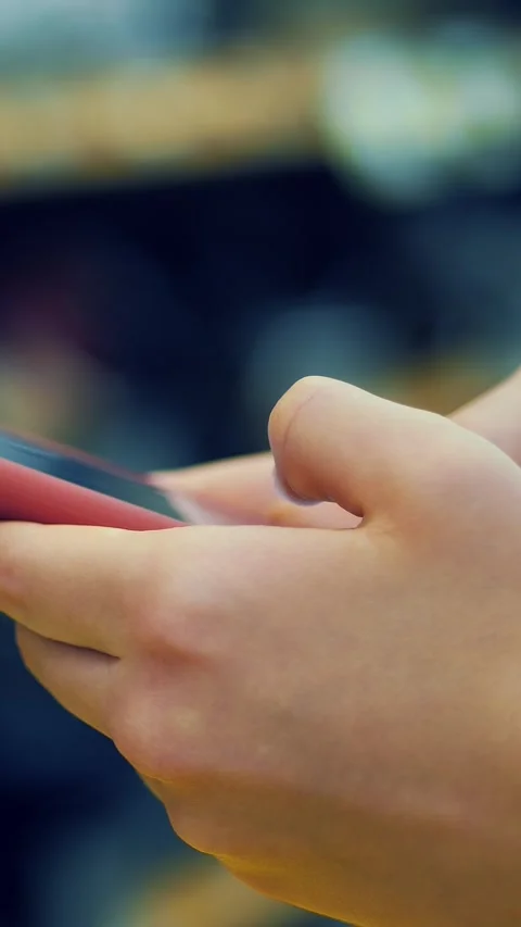 Mobile phone in supermarket. using of smartphone at grocery store. close-up. Video stock 314325357