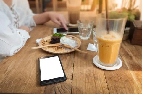 Mobile phone on table Stock Photos