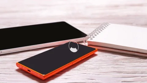 Mobile phone, tablet and notebook on office wooden desk, animated social network Stock Footage 85353228