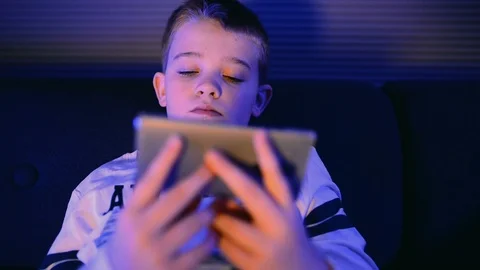Mobile phone is used in horizontal mode for streaming by a boy Stock Footage 98842503