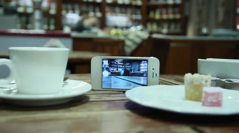 Mobile phone view the cafeteria coffee and visitors Stock Footage 50374685