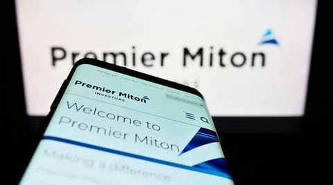 Mobile phone with website of British company Premier Miton Group plc on sc... Stock Photos