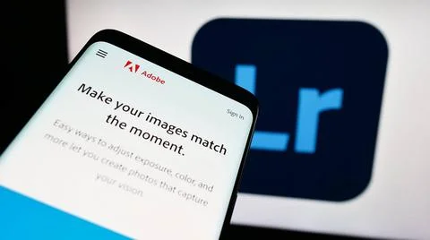  Mobile phone with website of image processing software Adobe Lightroom on... Stock Photos