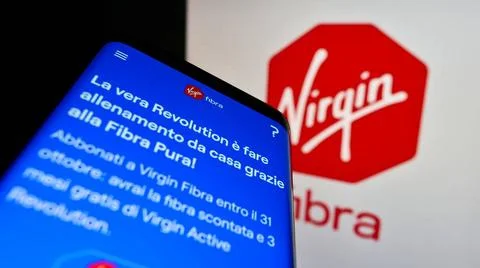 Mobile phone with website of Italian company Virgin Fibra S.r.l. on screen... Stock Photos