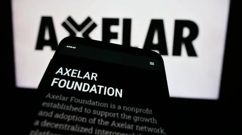 Mobile phone with website of network development company Axelar Foundation... Stock Photos