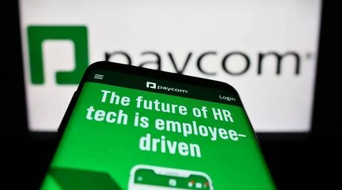 Mobile phone with website of payroll technology company Paycom Software In... Stock Photos