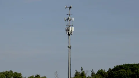 Mobile Phone Wireless Cellular Site Tower Poll Above Trees Centered Blue Sky Stock Footage 88849970