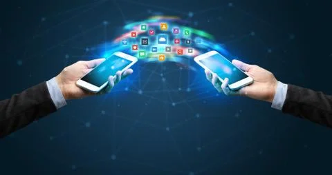 Mobile phones syncing application 库存照片