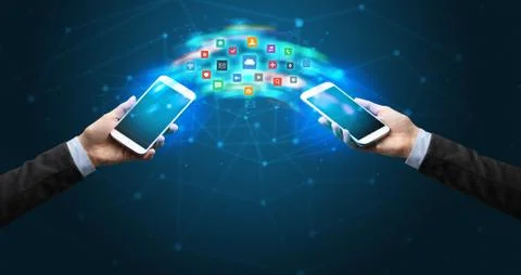 Mobile phones syncing application 库存照片