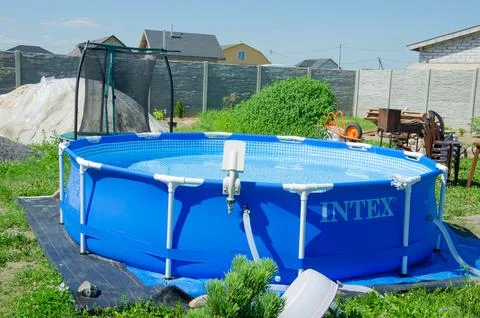 Mobile pool in the backyard, INTEX brand , round outdoor pool for the whole f Stock Photos