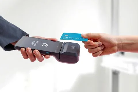 Mobile POS screen displaying payment approval interface with checkmark, foc.. Stock Photos