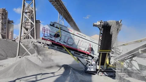 Mobile screening machine NFLG NFS 350 at Holcim quarry, Algeria Stock Footage 331330104