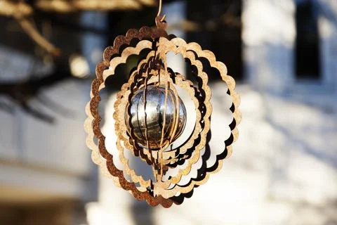 Mobile with silver ball hanging in a tree Stock Photos
