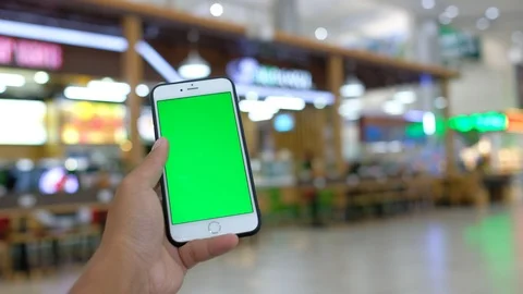 Mobile smart phone green screen display on hand Stock Footage 99043050