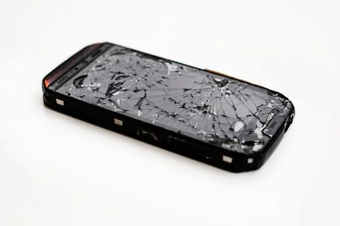 Mobile smartphone with broken screen isolated on white. Foto stock