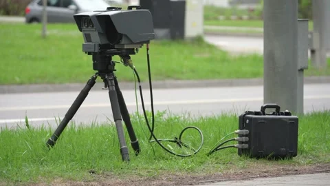 Mobile speed camera on a roadside tripod with cables and control box Stock Footage 336583281