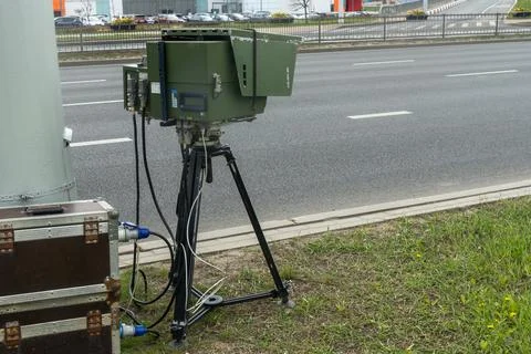 Mobile speed camera on a tripod at the roadside. Professional law enforceme.. Stock Photos