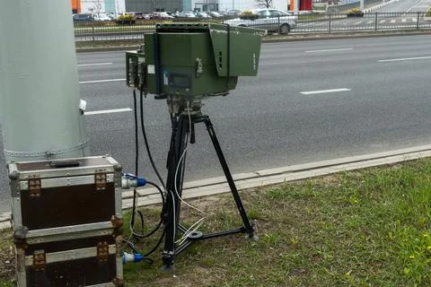 Mobile speed camera on a tripod at the roadside. Professional law enforceme.. Stock Photos