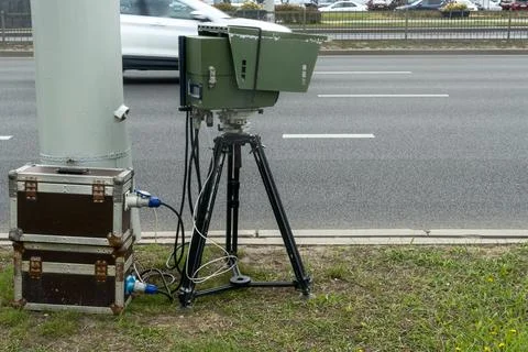Mobile speed camera on a tripod at the roadside. Professional law enforceme.. Stock Photos