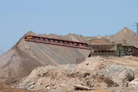 Mobile stone crusher machine by the construction site gravel mineral Stock Photos